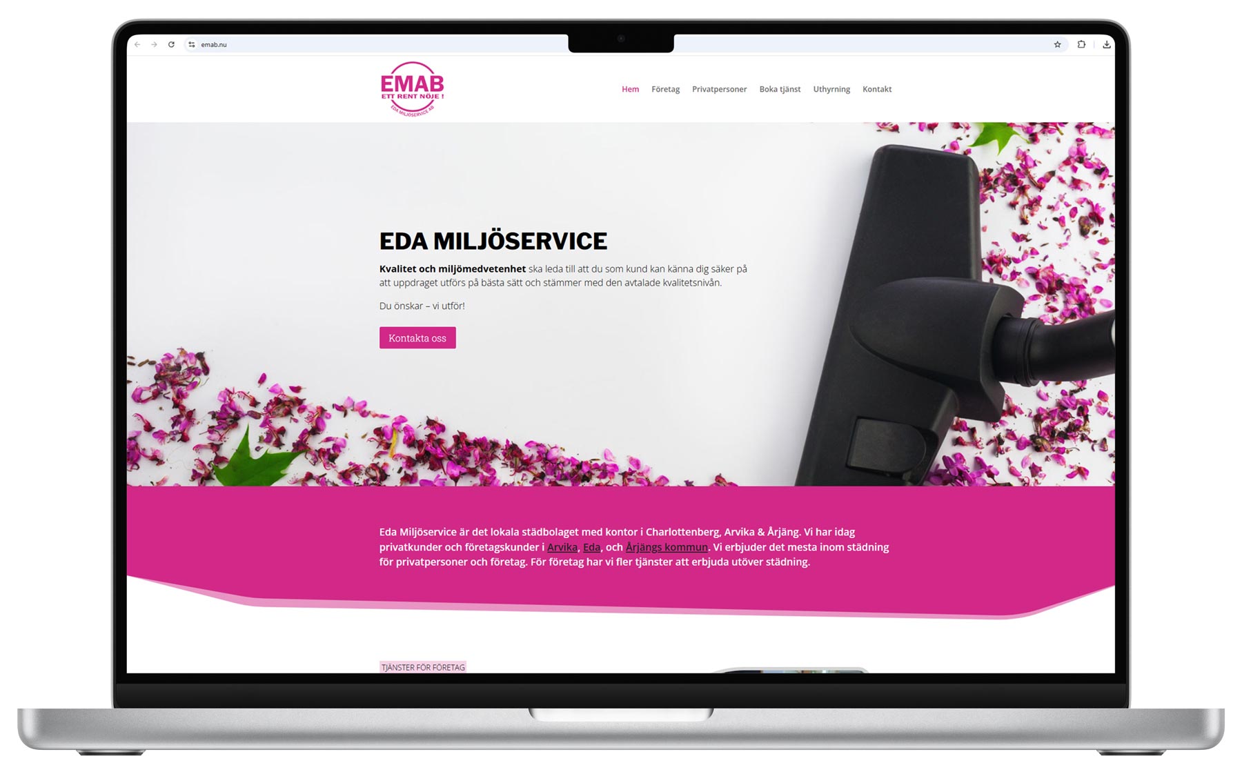 emab-desk-front Laptop som visar Eda Miljöservice webbplats med dammsugare och blomblad.